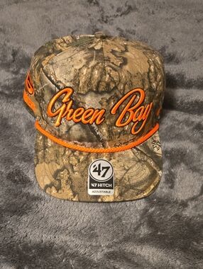 47 Green Bay Camo Hat with Orange Script